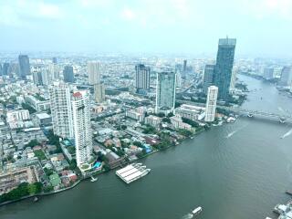 Aerial view of a city with river and high-rise buildings