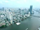 Aerial view of a city with river and high-rise buildings