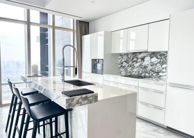 Modern kitchen with marble countertop and city view