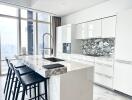 Modern kitchen with marble countertop and city view