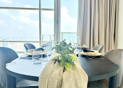 Dining area with table setup and city view