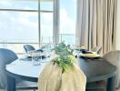 Dining area with table setup and city view