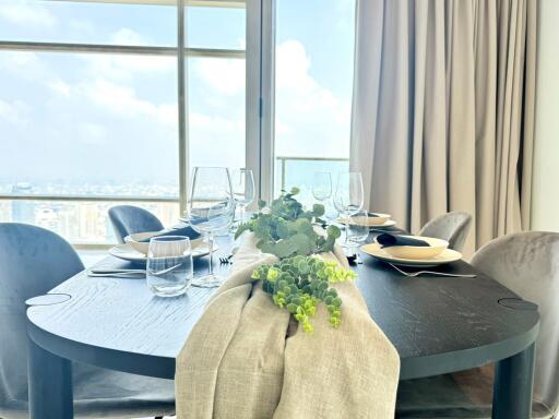 Dining area with table setup and city view