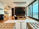 Modern living room with a large TV, piano, and a view of the city