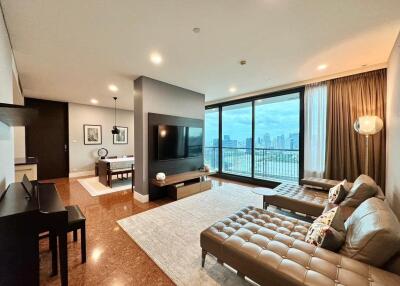 Spacious modern living room with large windows and city view