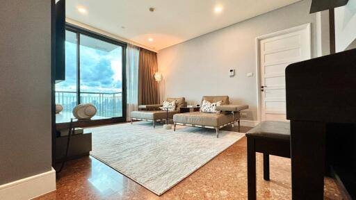 Modern living room with large window and comfortable seating