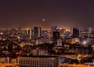 Night view of cityscape with high-rise buildings and illuminated streets