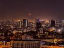 Night view of cityscape with high-rise buildings and illuminated streets