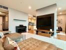 Modern living room with a sectional sofa, wall-mounted TV, and a piano