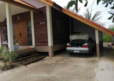 Exterior view of a residential property with carport