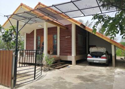 Exterior view of a house with carport