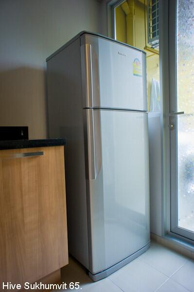 Kitchen with refrigerator.