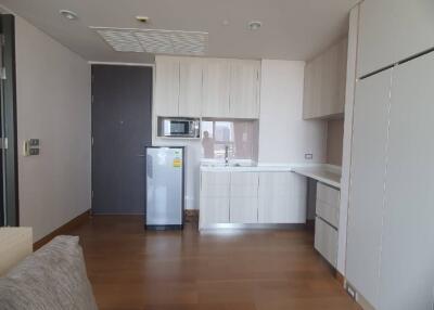 Modern kitchen with refrigerator and microwave