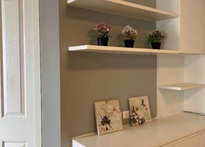 Stylish bedroom with shelves and cabinets