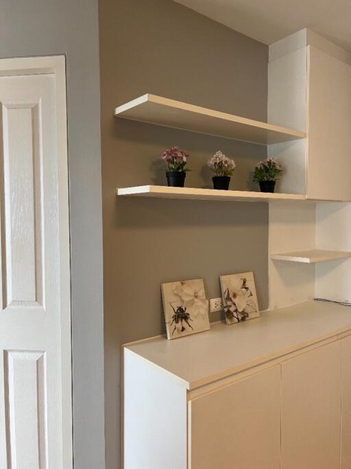 Stylish bedroom with shelves and cabinets