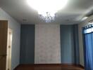 Bedroom with chandelier and blue walls