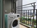 Laundry area with washing machine and drying rack