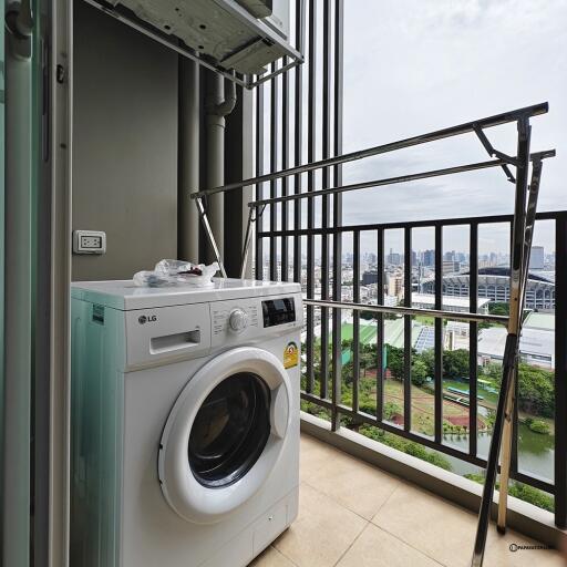 Laundry area with washing machine and drying rack