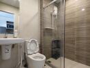 Modern bathroom with shower, toilet, and sink