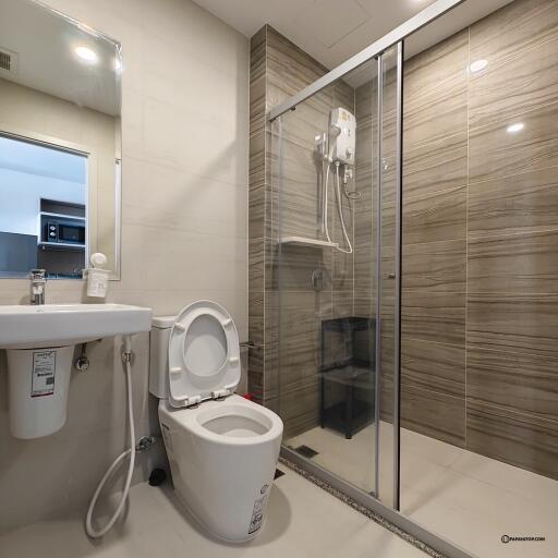 Modern bathroom with shower, toilet, and sink