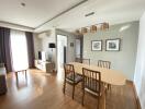 Modern living room with dining area and natural light