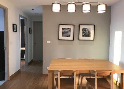 Modern dining area with wooden table and chairs