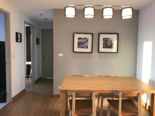 Modern dining area with wooden table and chairs