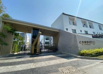 Modern residential building entrance with security gate