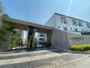 Modern residential building entrance with security gate