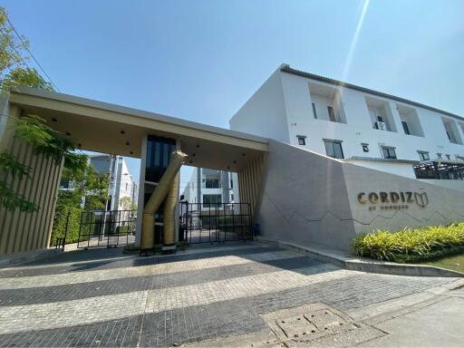 Modern residential building entrance with security gate