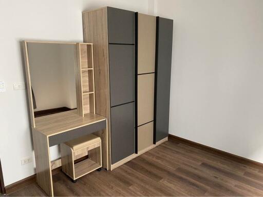 Bedroom with wardrobe and vanity