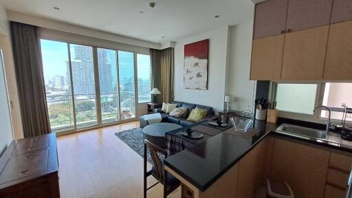 Modern living area with a kitchen and city view