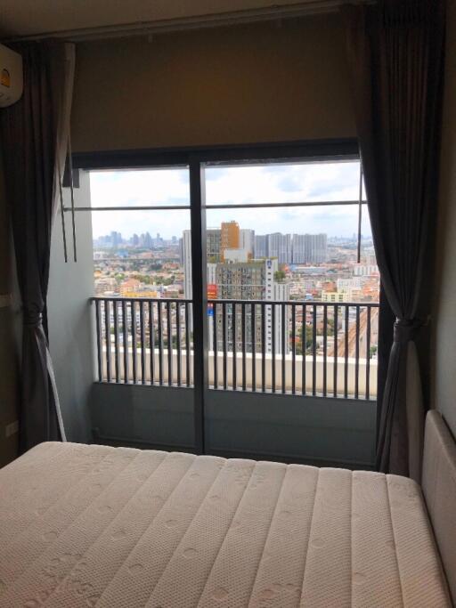 Bedroom with cityscape view