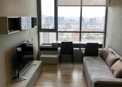 Modern living room with a window view in a high-rise building