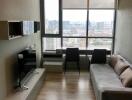 Modern living room with a window view in a high-rise building