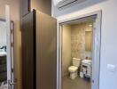 Bathroom view with modern fixtures and air conditioning unit