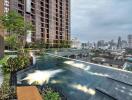 Modern high-rise residential building with rooftop infinity pool offering city skyline views