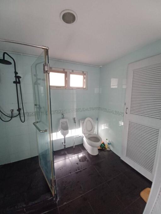 Bathroom with clear glass shower and toilet