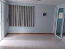 Spacious unfurnished living room with large windows