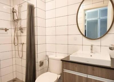 Modern bathroom with shower, toilet, and sink