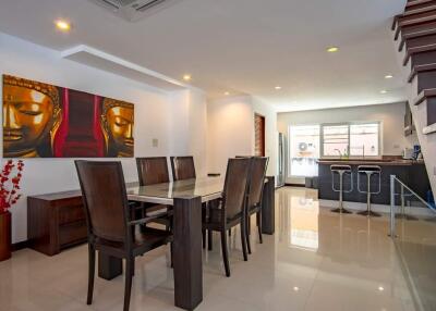 modern dining area with adjacent kitchen