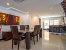 modern dining area with adjacent kitchen