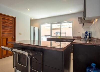 Modern kitchen with island and barstools