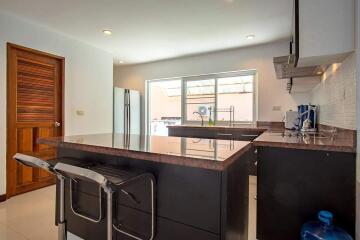 Modern kitchen with island and barstools