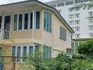 Exterior view of a residential building with surrounding greenery