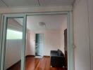 Living room with wooden floor and glass doors