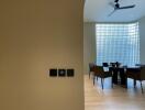 Dining area with modern furniture and large glass-block window