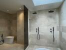 Modern bathroom with dual showers and a skylight