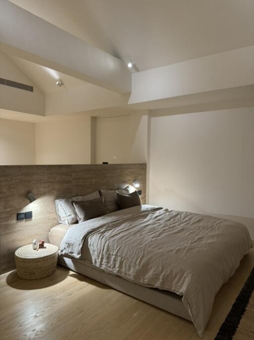 Modern bedroom with cozy lighting and neutral decor