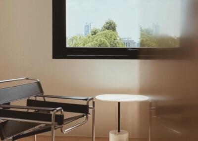 Modern living room with large window and stylish furniture